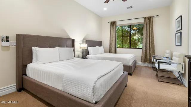 a bedroom with a bed and a couch