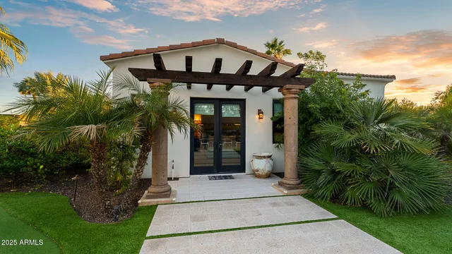 a front view of a house with garden