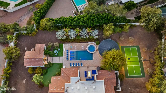 an aerial view of a house with outdoor space and street view