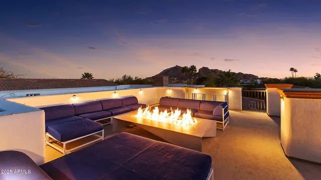 a view of swimming pool with outdoor seating and yard in back