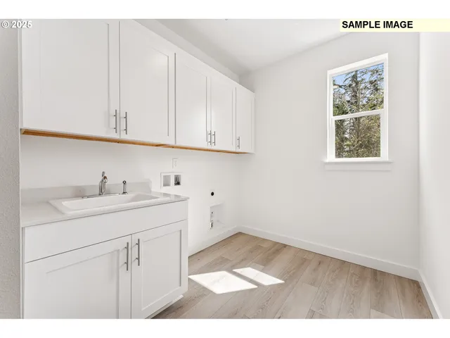 a view of a kitchen with a sink and a fireplace