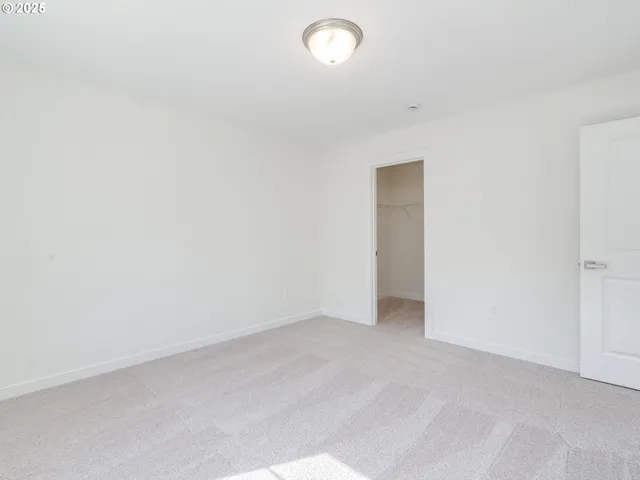 a bathroom with a sink a toilet and a large mirror