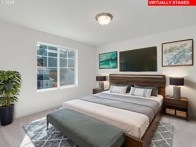 a bedroom with a bed and a potted plant