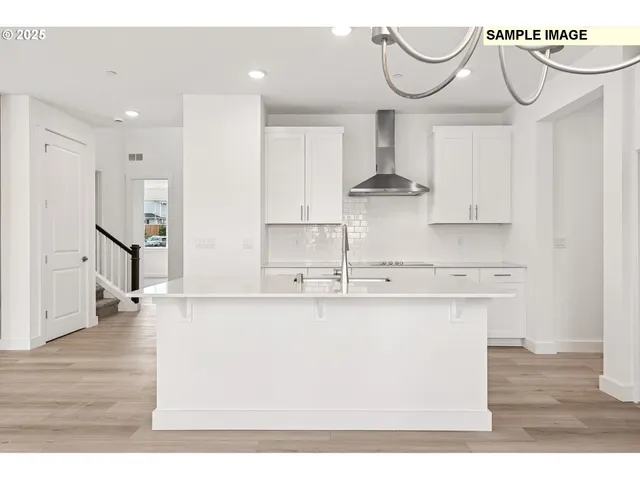 a en suite bathroom with a double vanity sink a mirror and a shower