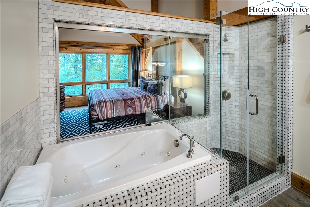 161 Hump View Trail Banner Elk, NC 28604 - Photo 44 of 50 a bathroom with a bathtub and a shower