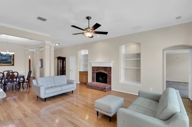 a view of a dining room with furniture and chandelier