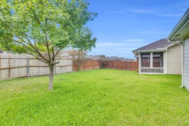 a view of a backyard with a garden