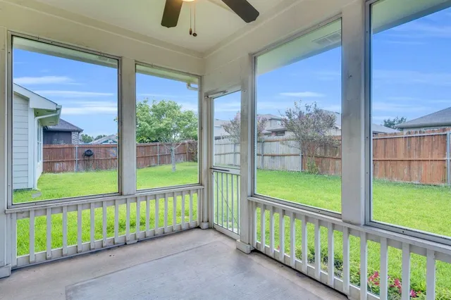 a view of a livingroom with furniture window and wooden floor