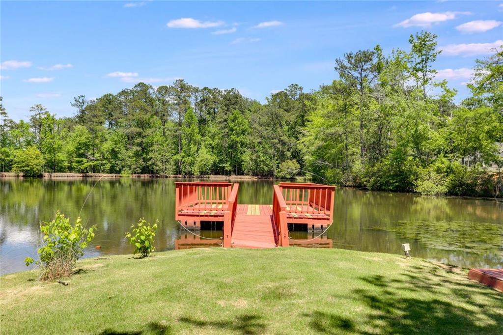 110 Pond View Point LaGrange, GA 30240 - Photo 59 of 68 a backyard of a house with lots of green space and lake view