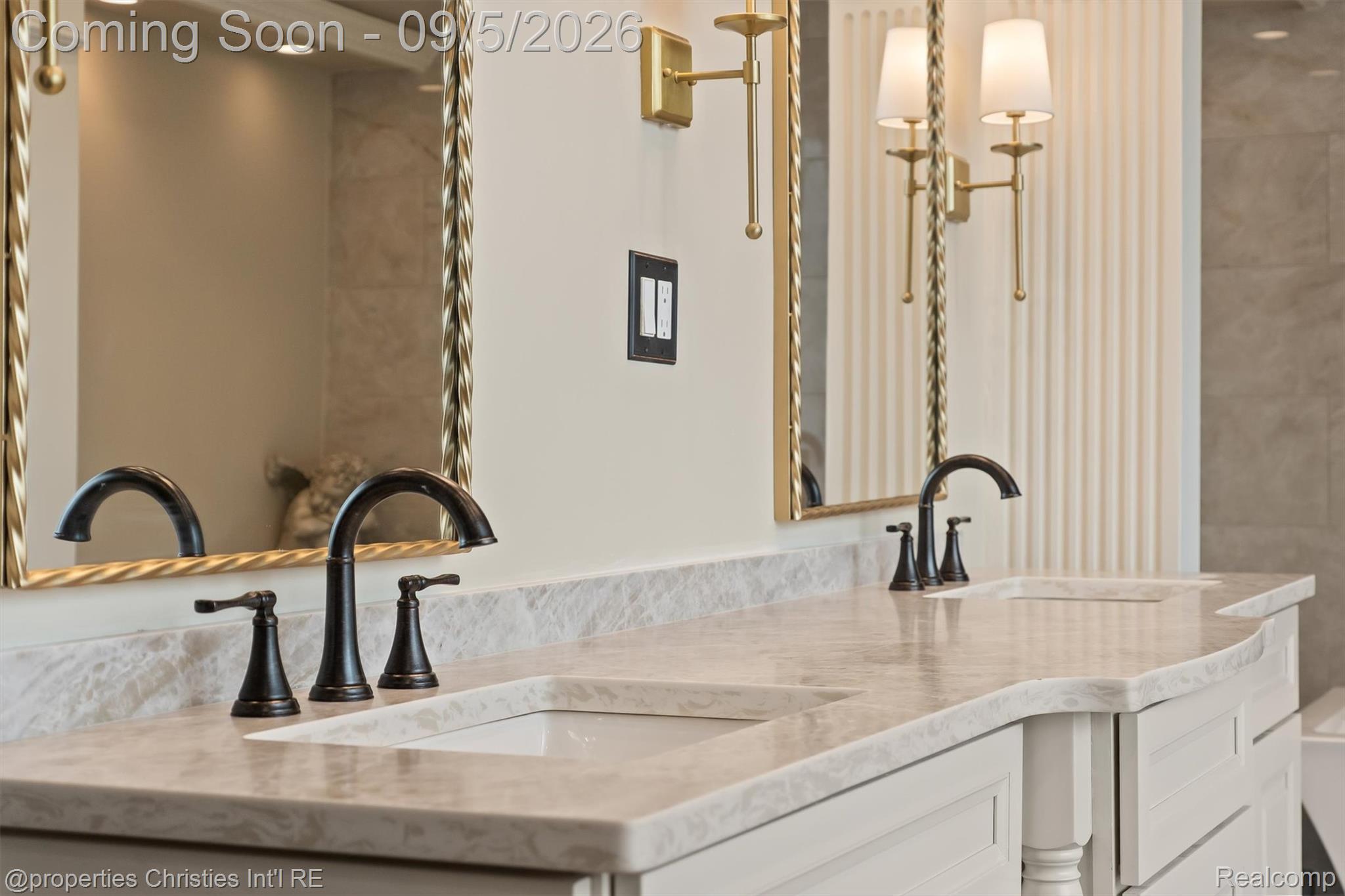 1540 Mill Race Road Rochester, MI 48306 - Photo 69 of 99 Luxurious dual-sink vanity featuring a polished stone countertop, integrated rectangular basins, and matte black widespread faucets
