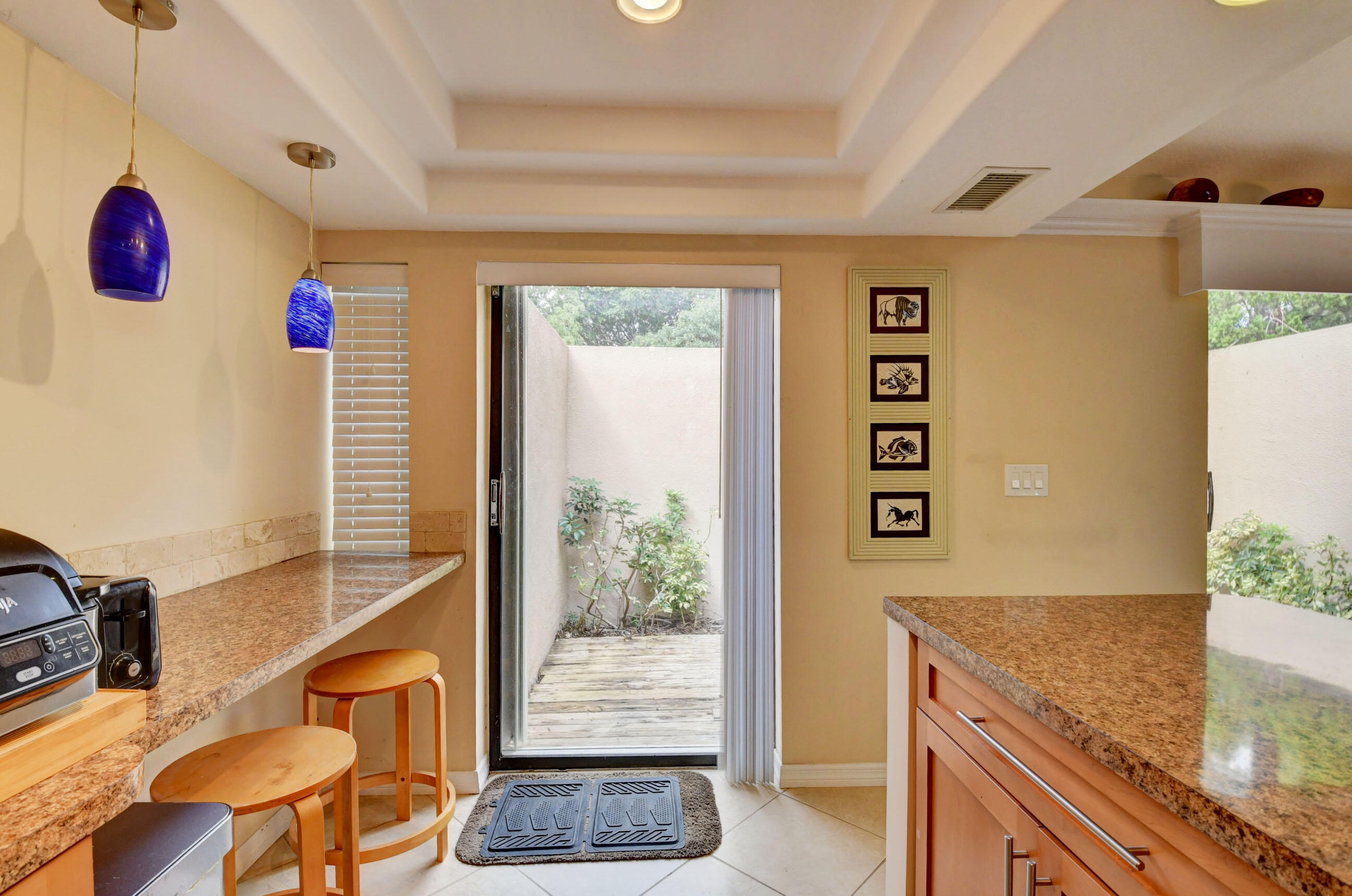 1141 Northwest 13th Street, Unit 1 Boca Raton, FL 33486 - Photo 13 of 28 Breakfast Bar with Pendant Lighting