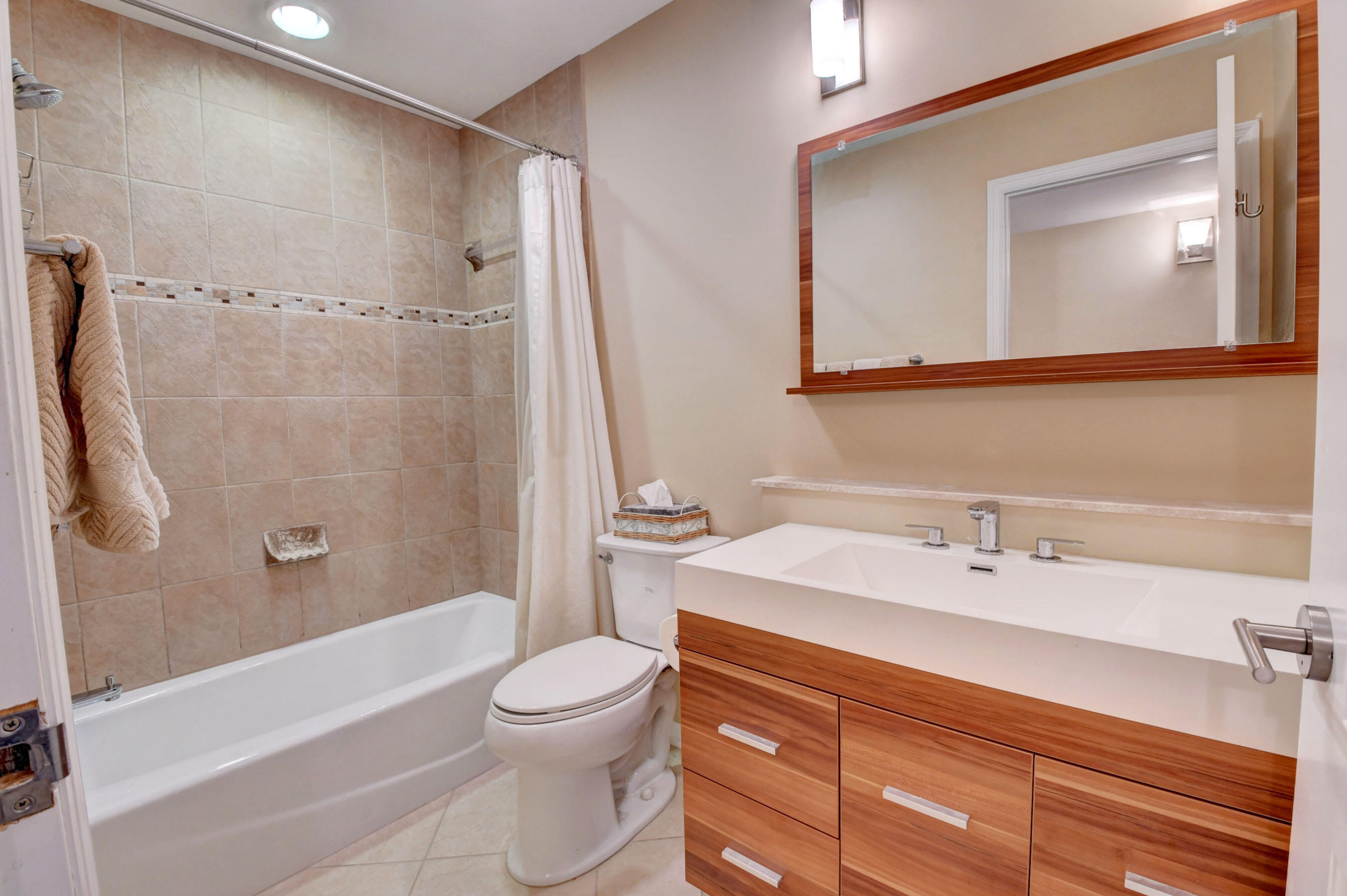 1141 Northwest 13th Street, Unit 1 Boca Raton, FL 33486 - Photo 24 of 28 Guest Bath with Tub and Shower Combo