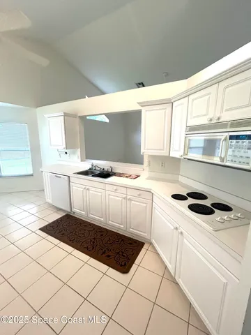 a view of a bathroom with a sink and a window