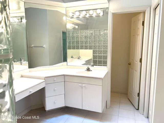 a bathroom with a shower and a sink