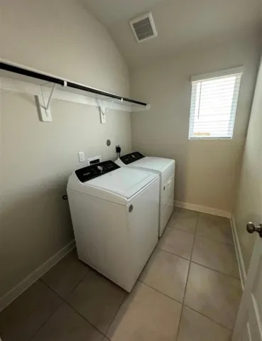 an empty room with a empty space and windows