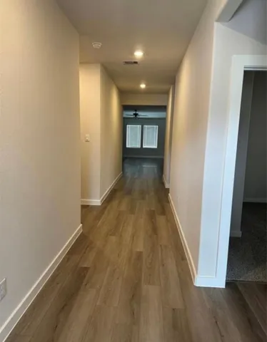 a kitchen with a sink stainless steel appliances and cabinets