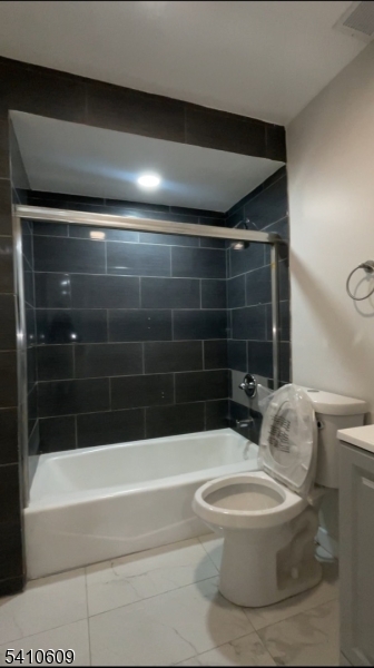 178 3rd Street, Unit 2 Elizabeth Port, NJ 07206 - Photo 2 of 3 a bathroom with a toilet and a bathtub
