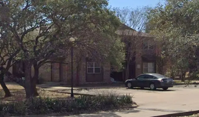 a car parked in front of a house