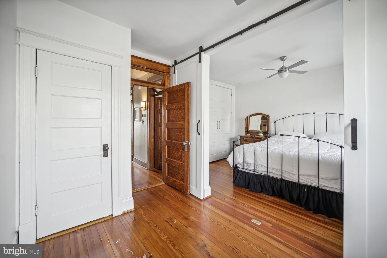 3617 13th Street Northwest Washington, DC 20010 - Photo 15 of 23 a bedroom with a bed and wooden floor