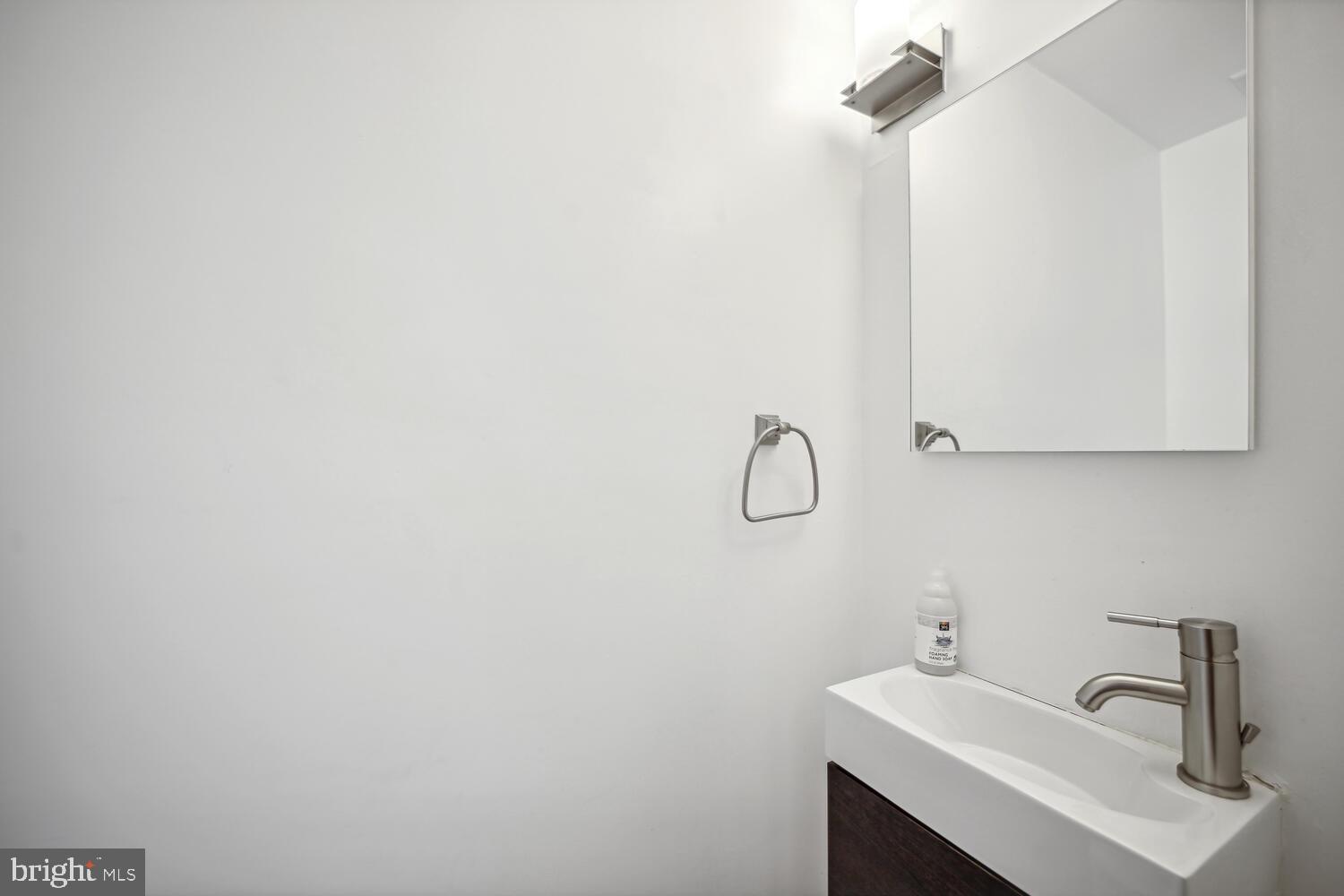 3617 13th Street Northwest Washington, DC 20010 - Photo 18 of 23 a bathroom with a sink and mirror