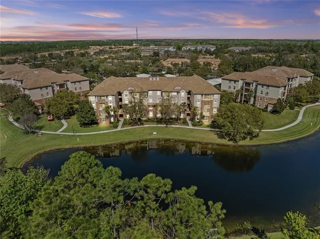 a view of outdoor space with swimming pool and lake view