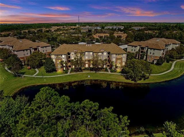 a view of a living room with a table and chairs