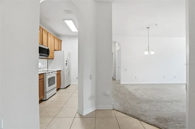 a kitchen with stainless steel appliances a refrigerator and a stove