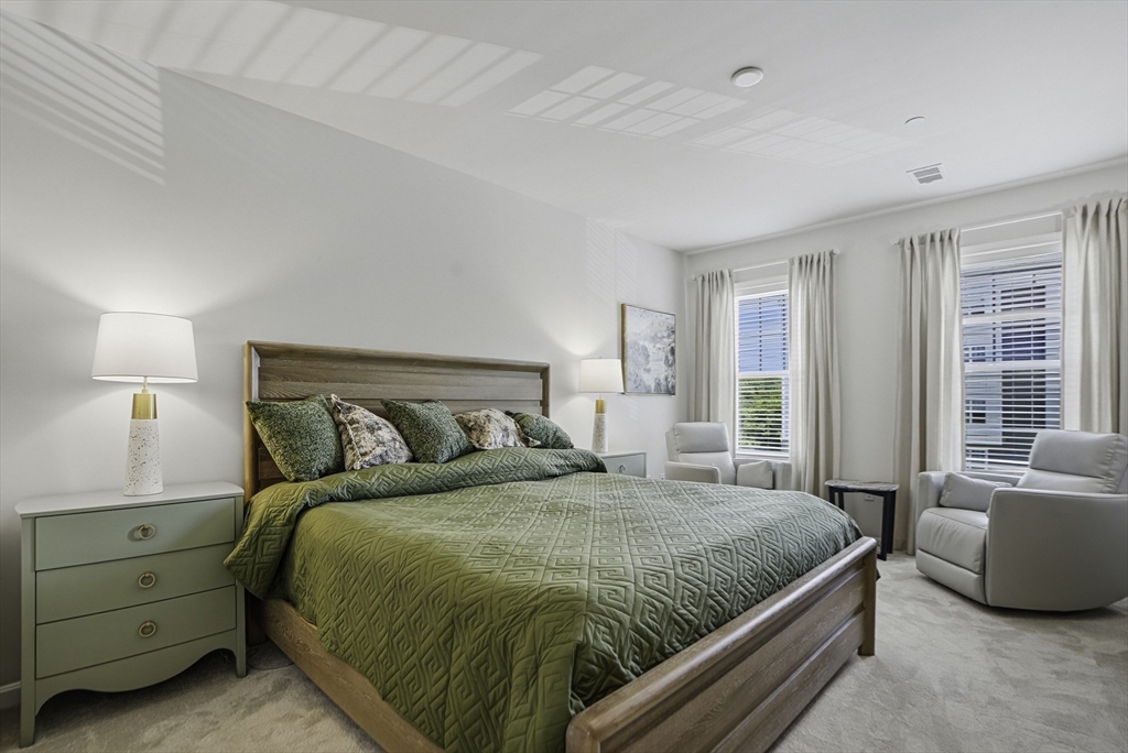 2 Codman Way, Unit 2203 Westborough, MA 01581 - Photo 16 of 36 a bedroom with a bed and a couch
