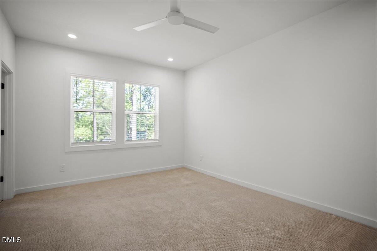 6419 Tanner Oak Lane Raleigh, NC 27613 - Photo 23 of 39 an empty room with windows
