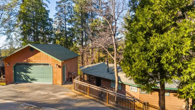 a view of a house with a tree