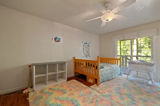 a bedroom with furniture and a window