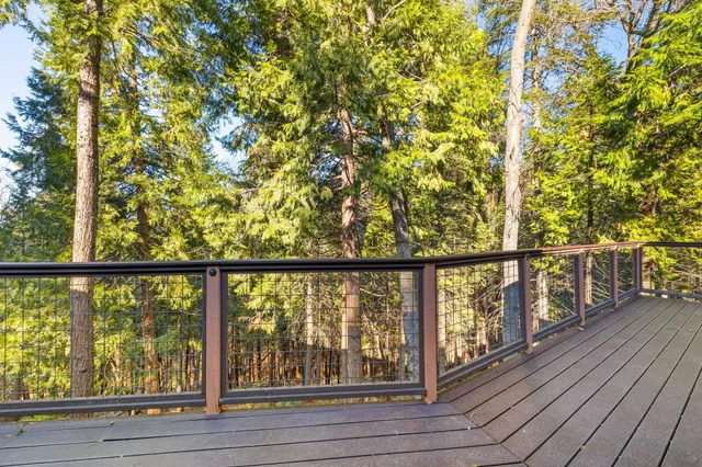 a view of staircase with railing and wooden floor