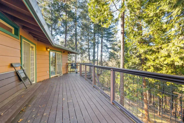 a view of balcony with wooden floor