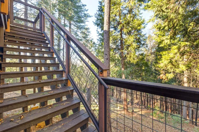 a view of balcony with wooden stairs