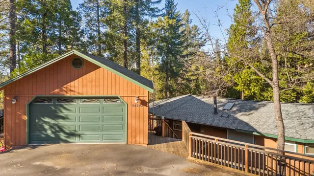 a backyard of a house with a garden and deck