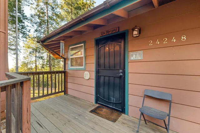 a view of front door and deck of the house