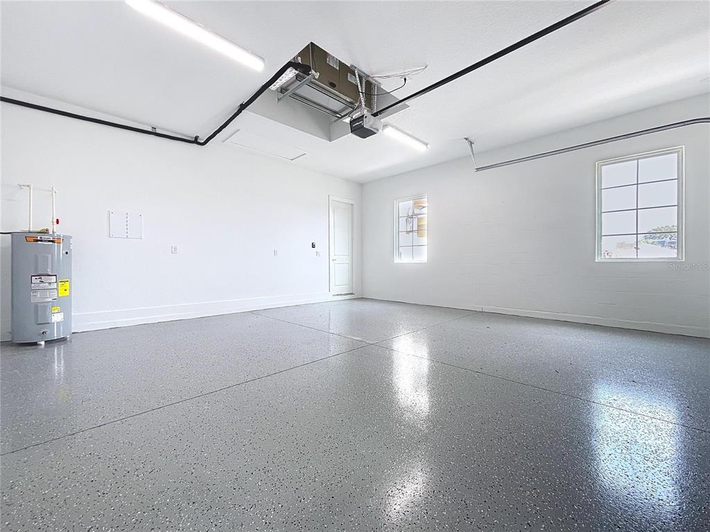 9065 Mississippi Run Weeki Wachee, FL 34613 - Photo 25 of 86 a view of a livingroom with a ceiling fan and window
