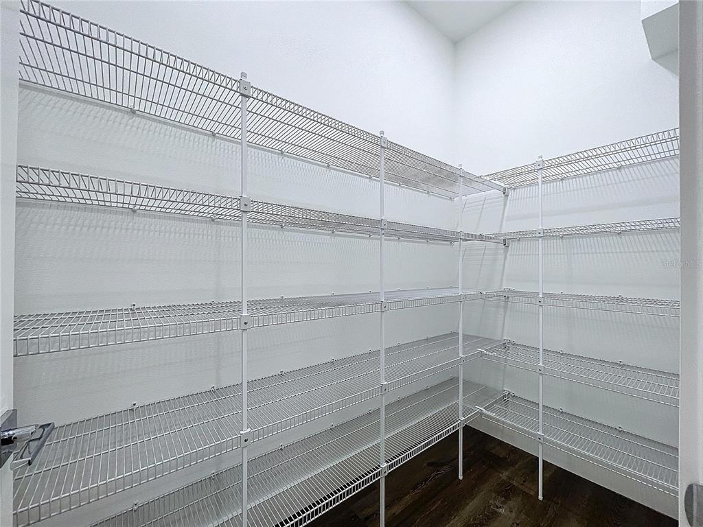 9065 Mississippi Run Weeki Wachee, FL 34613 - Photo 28 of 86 a view of a room with shelf on the wall