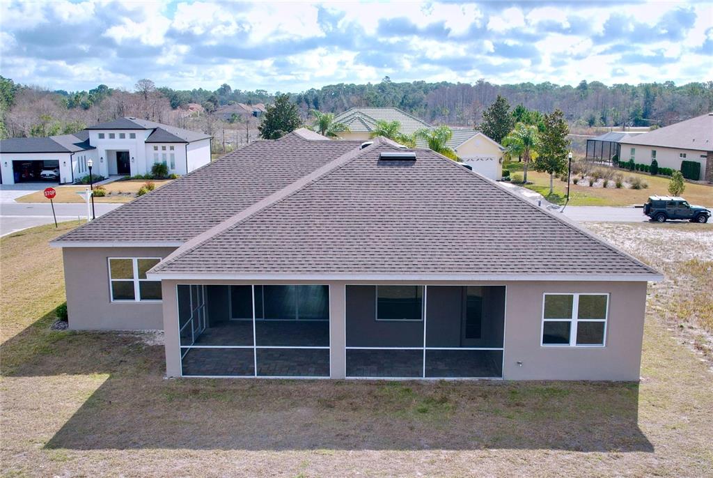 9065 Mississippi Run Weeki Wachee, FL 34613 - Photo 35 of 86 a front view of a house with a yard and garage