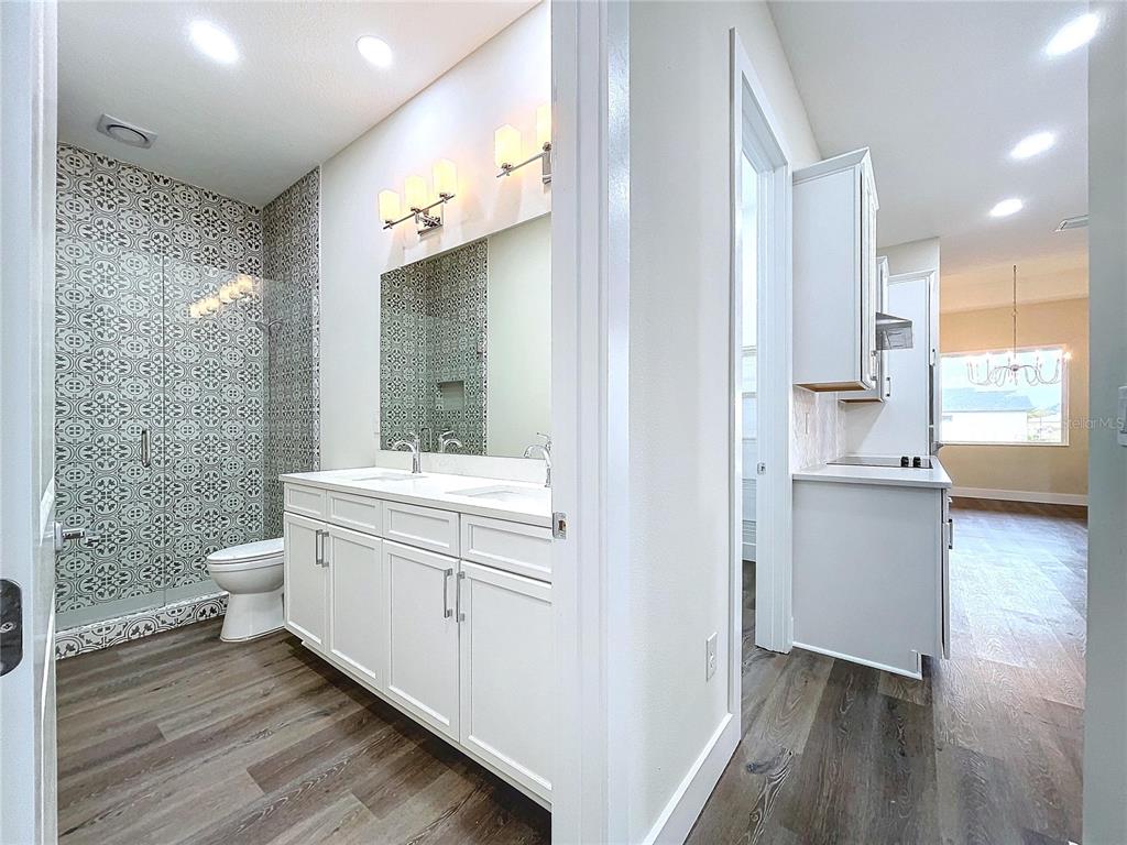 9065 Mississippi Run Weeki Wachee, FL 34613 - Photo 45 of 86 a bathroom with a sink a toilet and shower