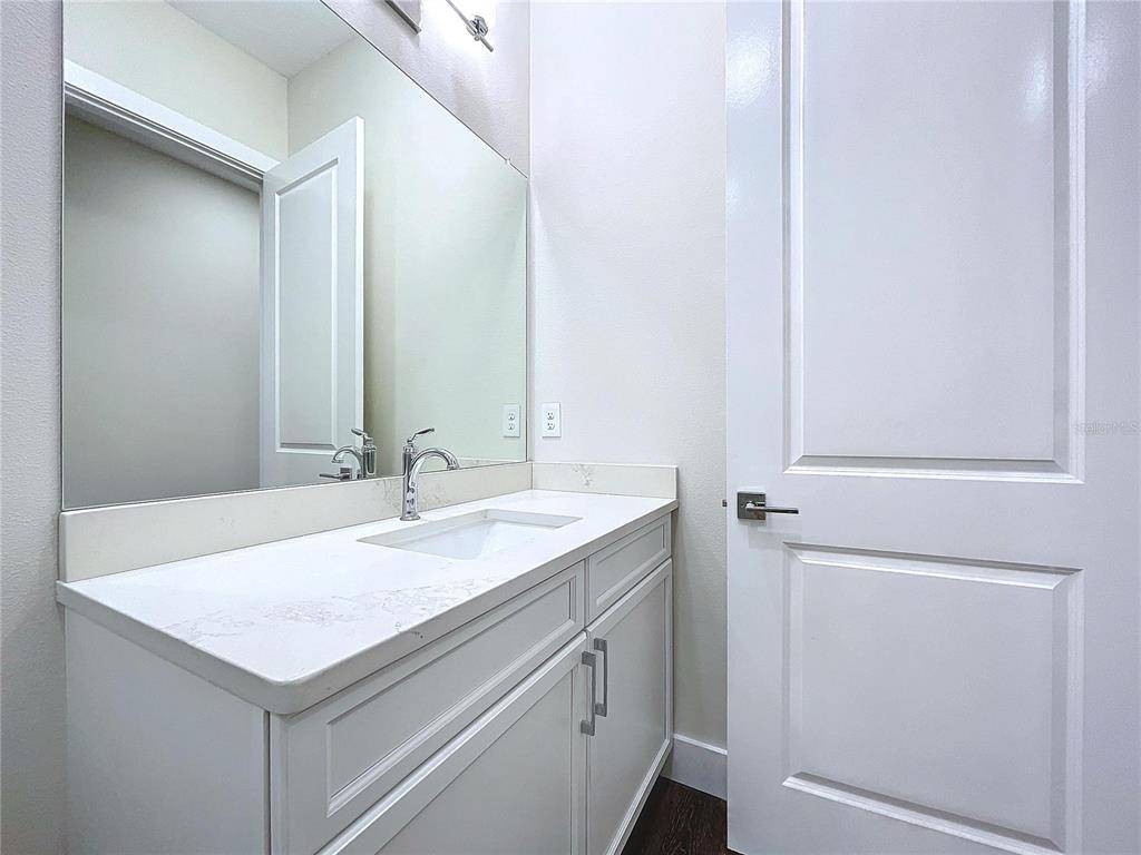 9065 Mississippi Run Weeki Wachee, FL 34613 - Photo 61 of 86 a bathroom with a sink and a mirror