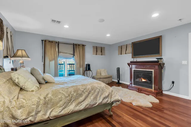a bedroom with a bed and a fireplace