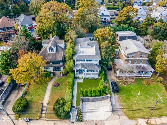 an aerial view of a house with a swimming pool
