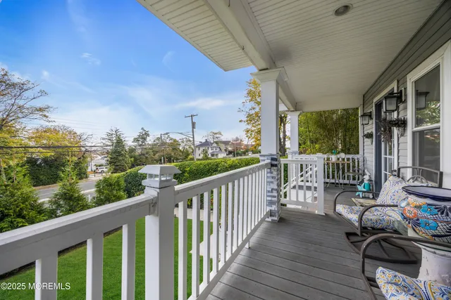 a view of a chair and tables in the balcony