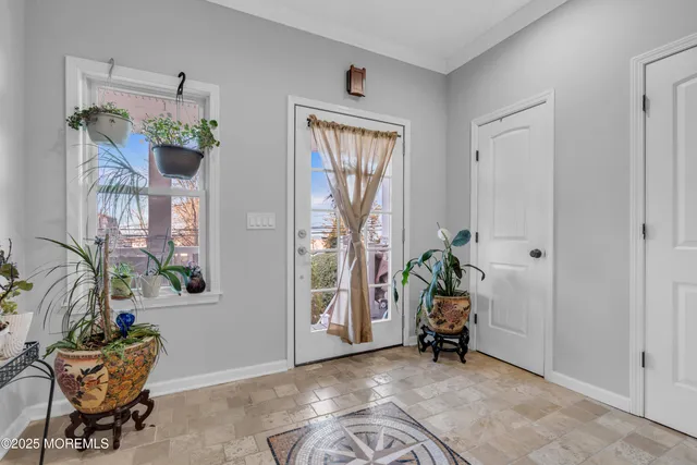 a view of a livingroom with furniture and a window