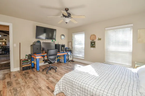 a bedroom with furniture and a window