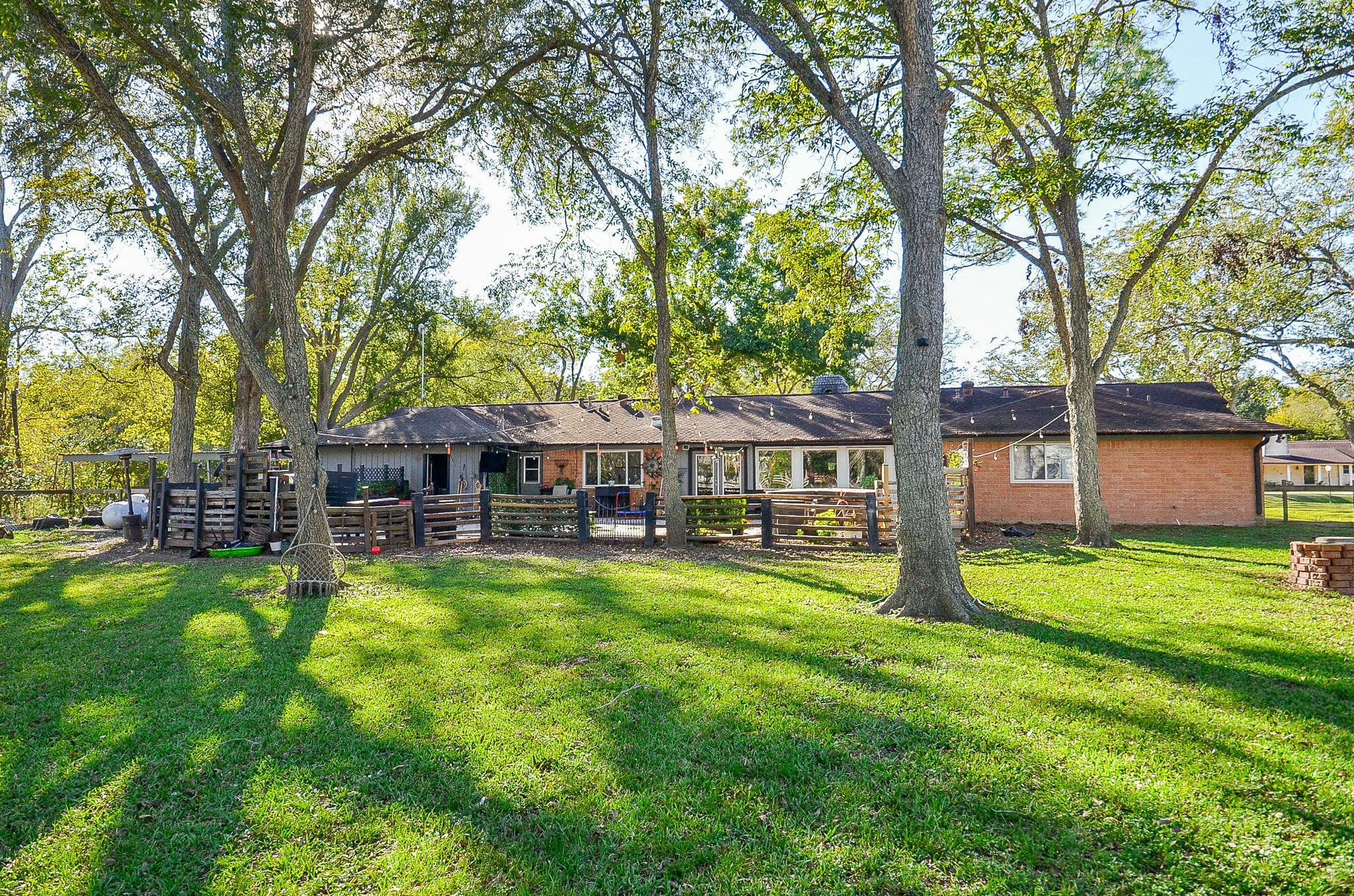 720 Surrey Drive Simonton, TX 77485 - Photo 21 of 34 a swimming pool with outdoor seating and yard