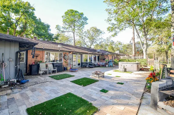 a front view of a house with garden and patio