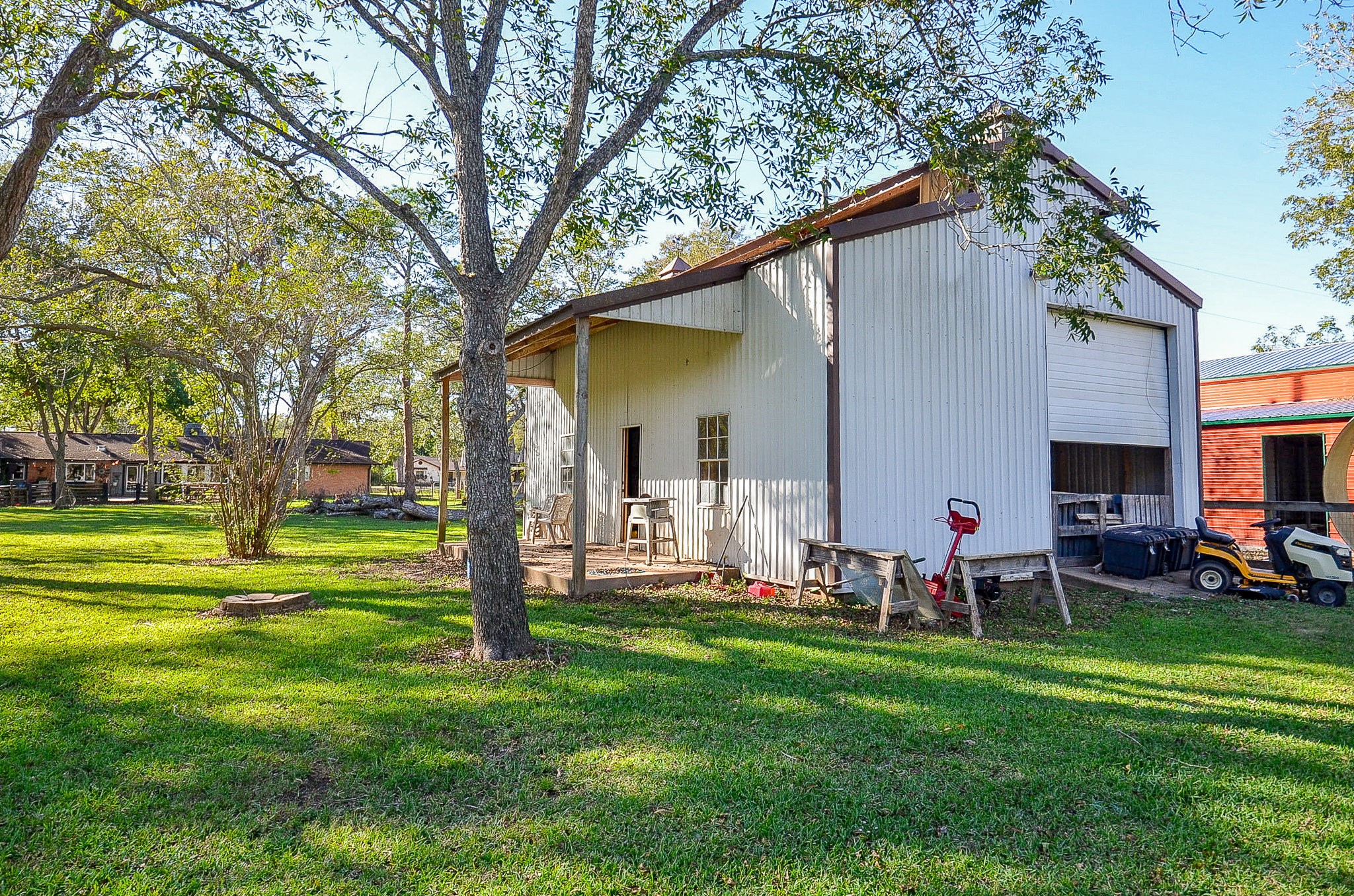 720 Surrey Drive Simonton, TX 77485 - Photo 23 of 34 a backyard of a house with garden and outdoor seating