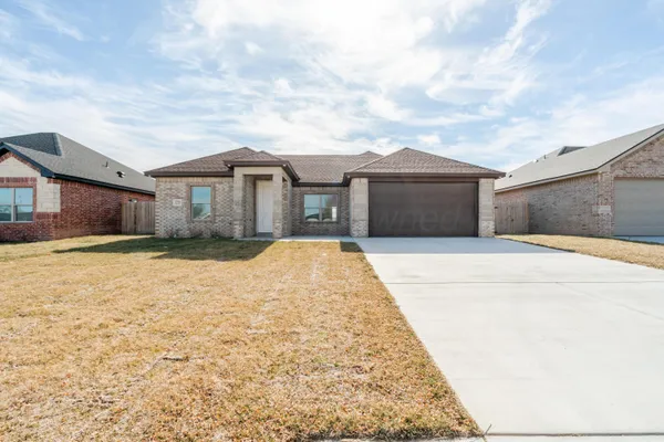 a front view of a house with a outdoor space